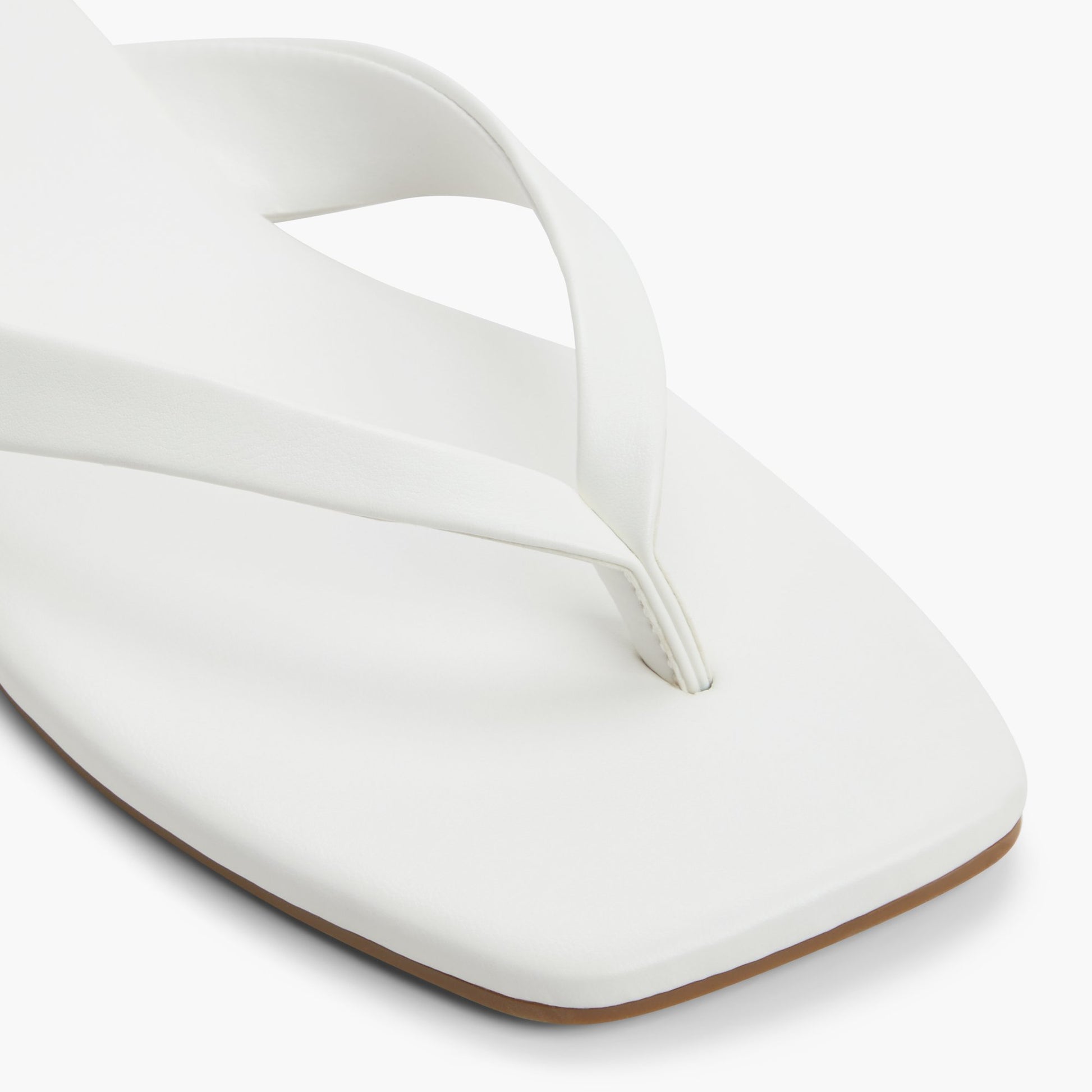 Close-up of the White Kayce Thong Sandals