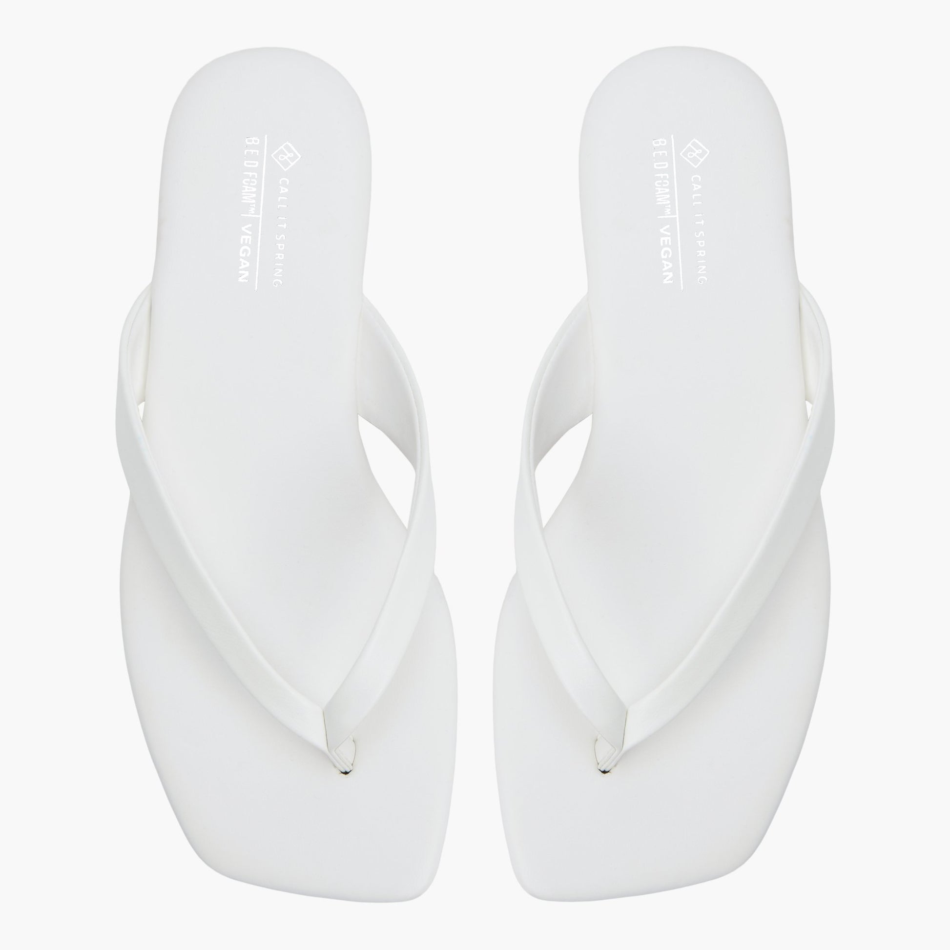 Top-down view of the White Kayce Thong Sandals