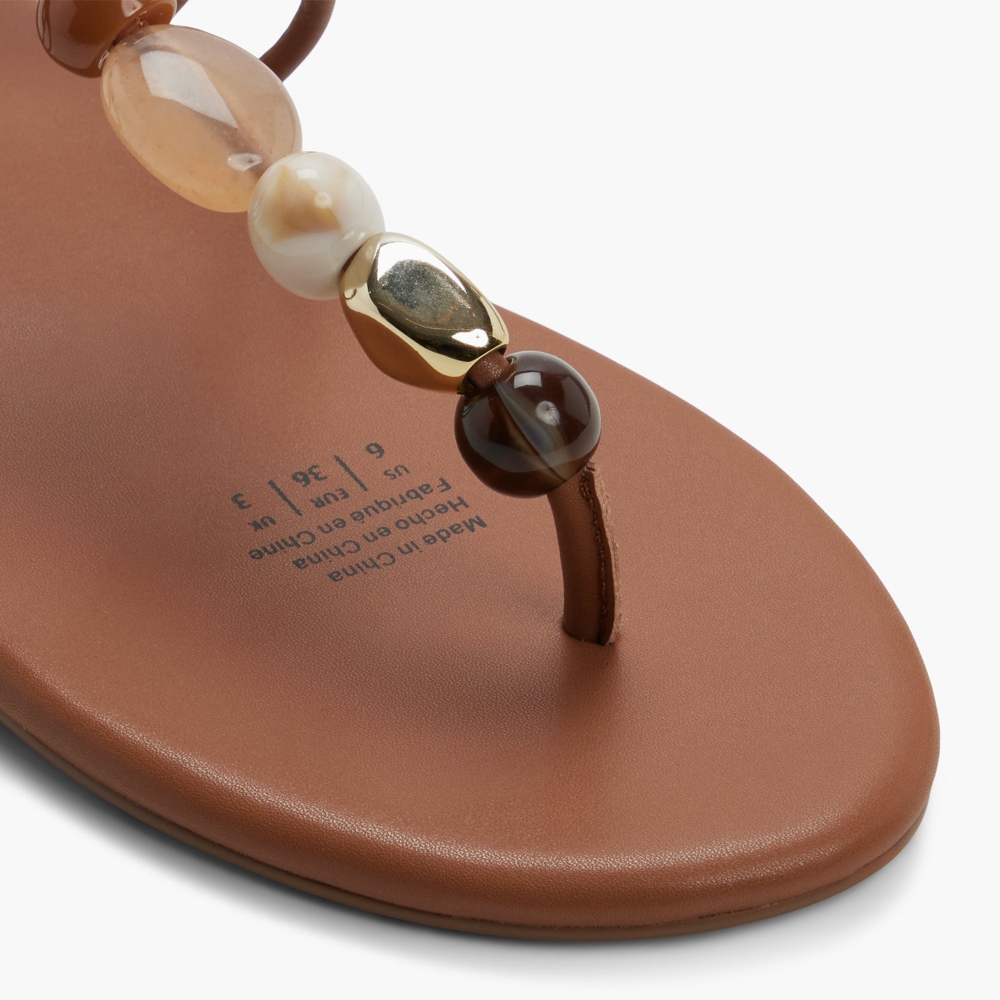 Close-up of the Cognac Topaaz T-Bar Thong Sandals