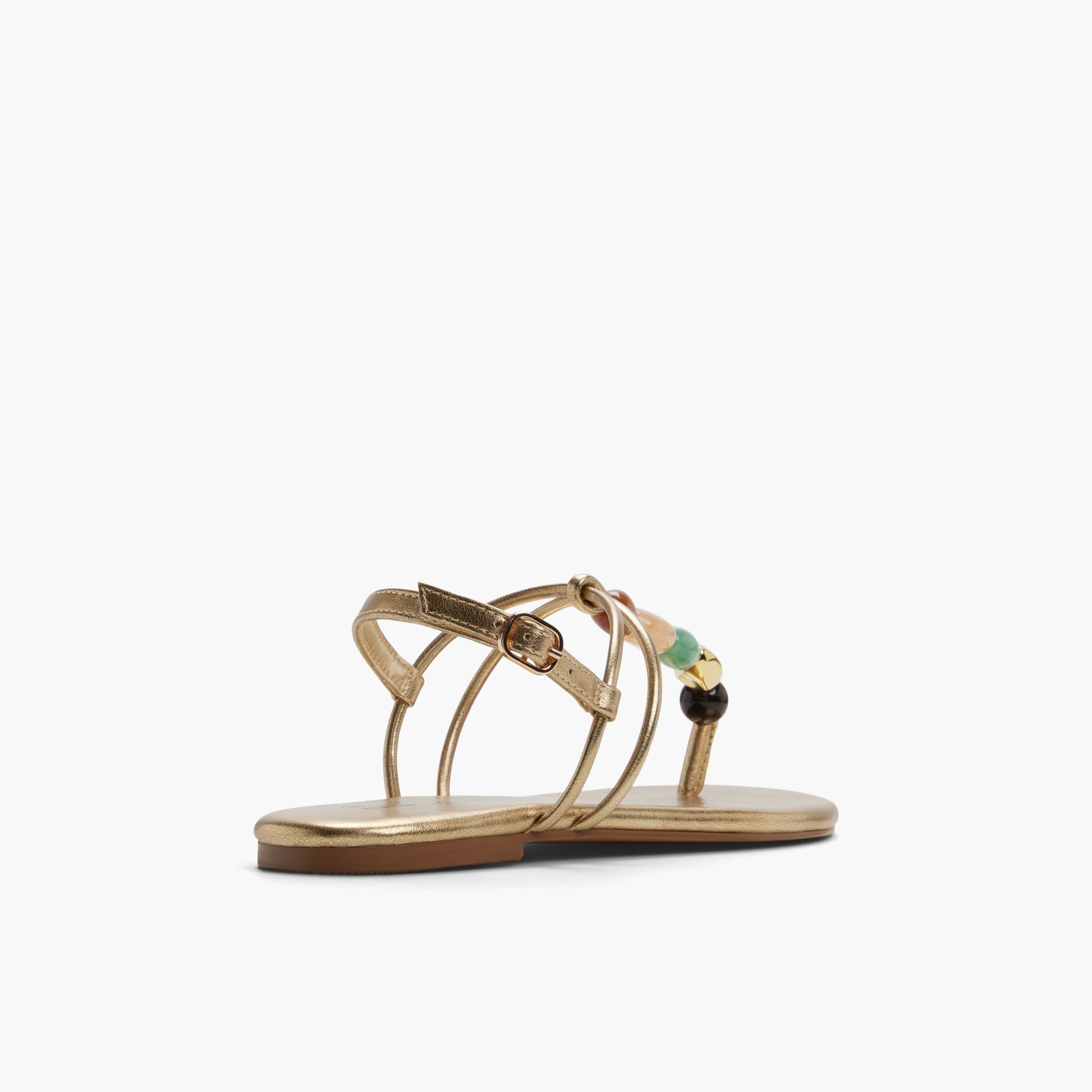 Three-quarter angle of Gold Topaaz T-Bar Thong Sandals's back side