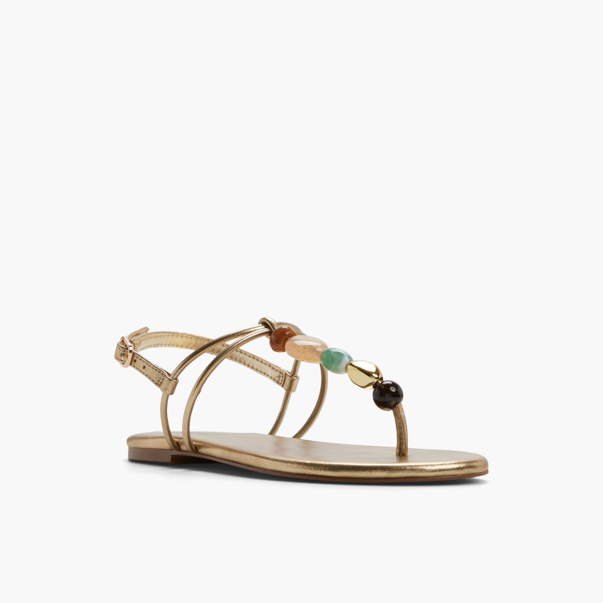 Three-quarter angle of Gold Topaaz T-Bar Thong Sandals's front side